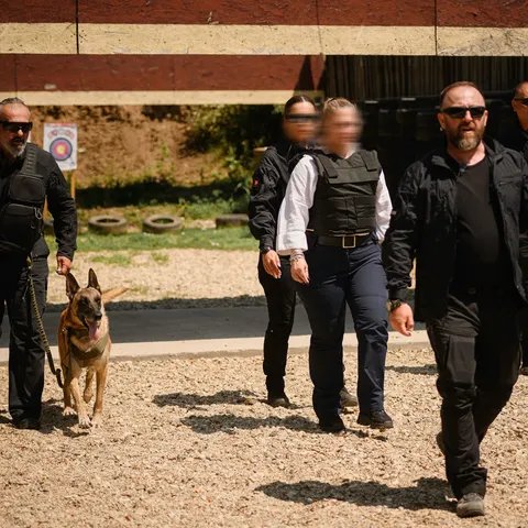 Close protection team escorting a principal